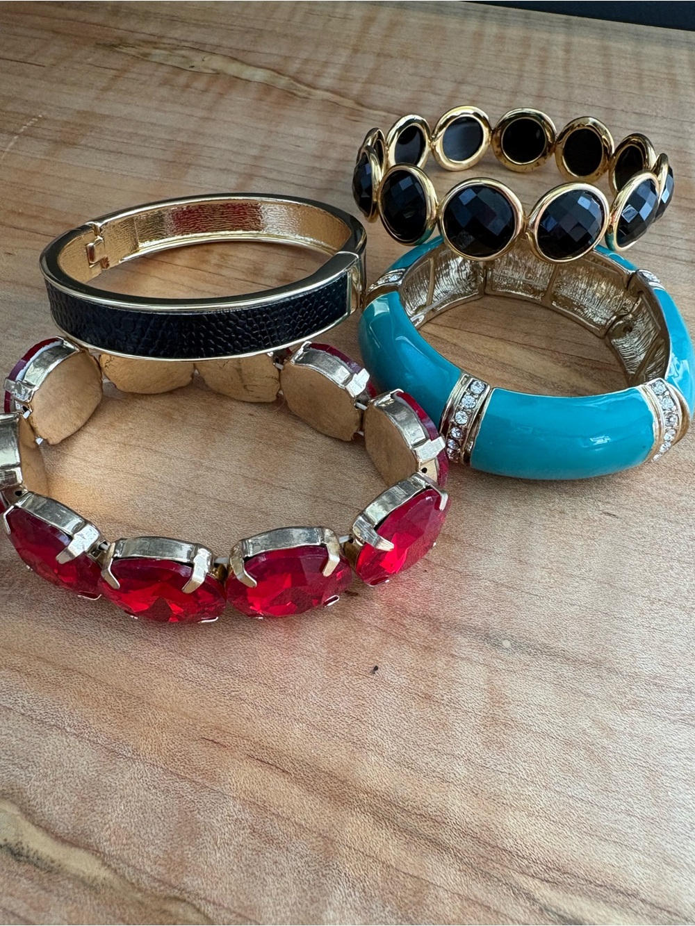 Set of 4 Gold-Tone Bracelets with Red, Black, and Turquoise Accents